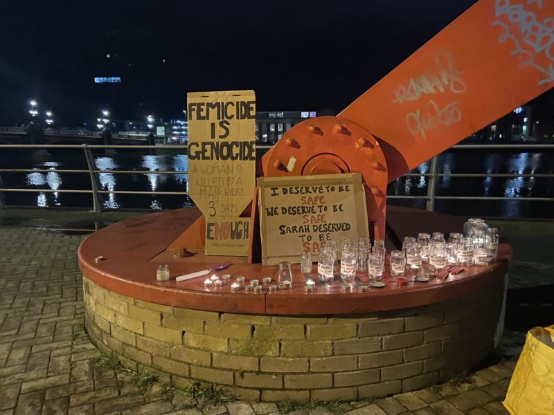 Candles and signs in memory of Sarah Everard and Winjing Lin and all women who have been victims of violent acts committed by men